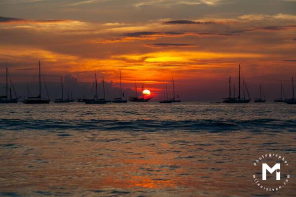 sea sunset with fishing boats