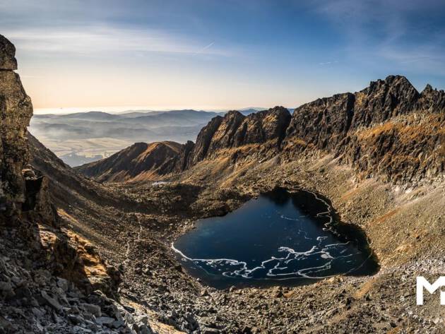 Big mountains valley with the lake