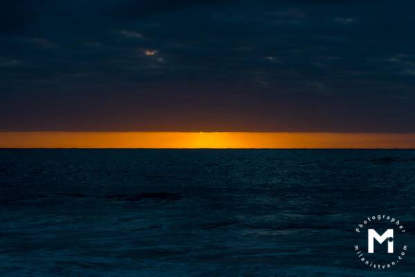 Horizontal sunrise light at the ocean