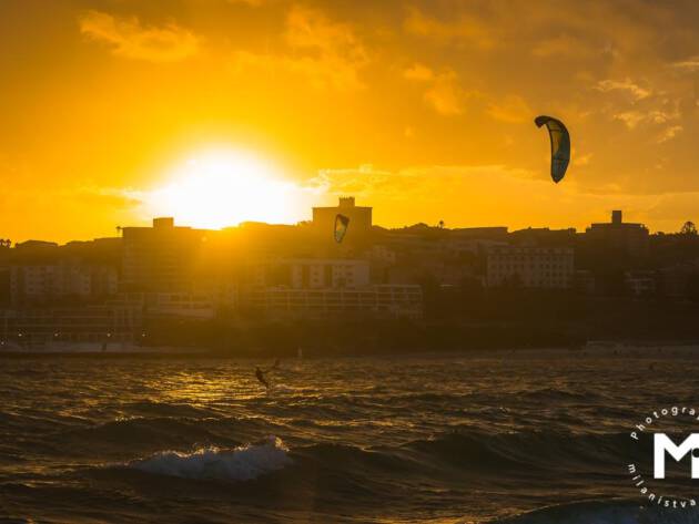Kitesurfer at the sunrise