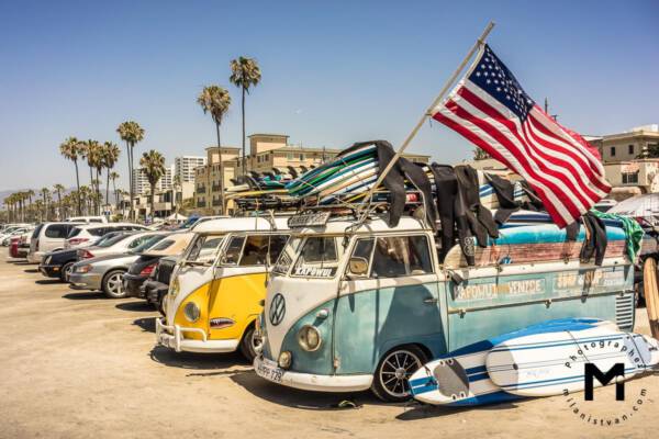 Old van with american flag at the parking place