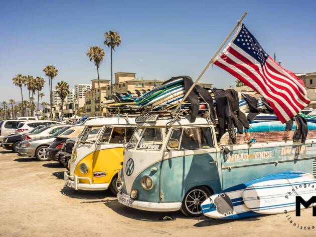 Old van with american flag at the parking place