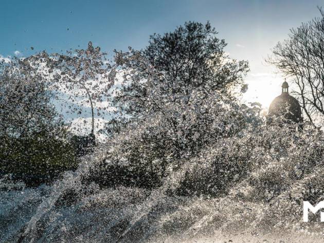 Big water fountain in the summer light